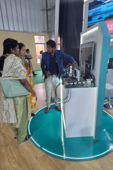 Attendees at Electronica India 2025 observing live demonstration comparing Semtech SurgeSwitch TDS2211P flat clamping protection device against traditional TVS diode under identical pulse conditions