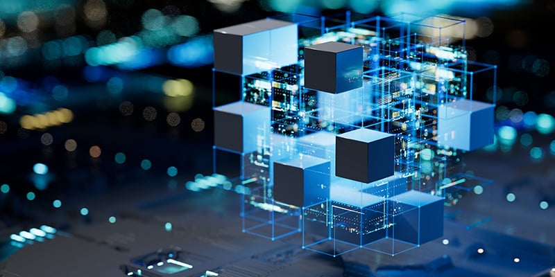 Alt text: Futuristic 3D visualization of interconnected digital cubes with glowing blue edges floating above a circuit board, representing advanced data management technology. This abstract digital transformation imagery illustrates Enthu Technology's energy management solution that provided Wheels India Pvt. Ltd. with real-time monitoring capabilities and delivered 10% energy savings through optimized resource utilization.