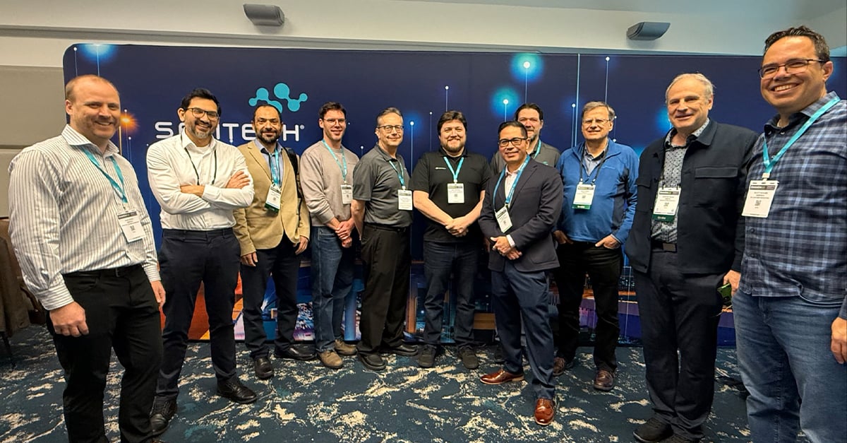Members of the Semtech and TE Connectivity teams gather in front of a Semtech branded backdrop at DesignCon 2026, following the presentation of their co-authored paper on 400G copper interconnect technology for AI applications.