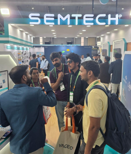 rowd of attendees at Semtech booth during Electronica India 2025 watching demonstration of PerSe Contact sensor technology for smart wearables control