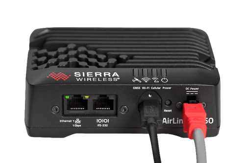 A black box with red and white cables
Description automatically generated
