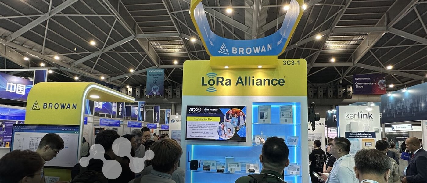 LoRa Alliance booth at ATxSG 2026 in Singapore, surrounded by partner exhibits and attendees on the show floor