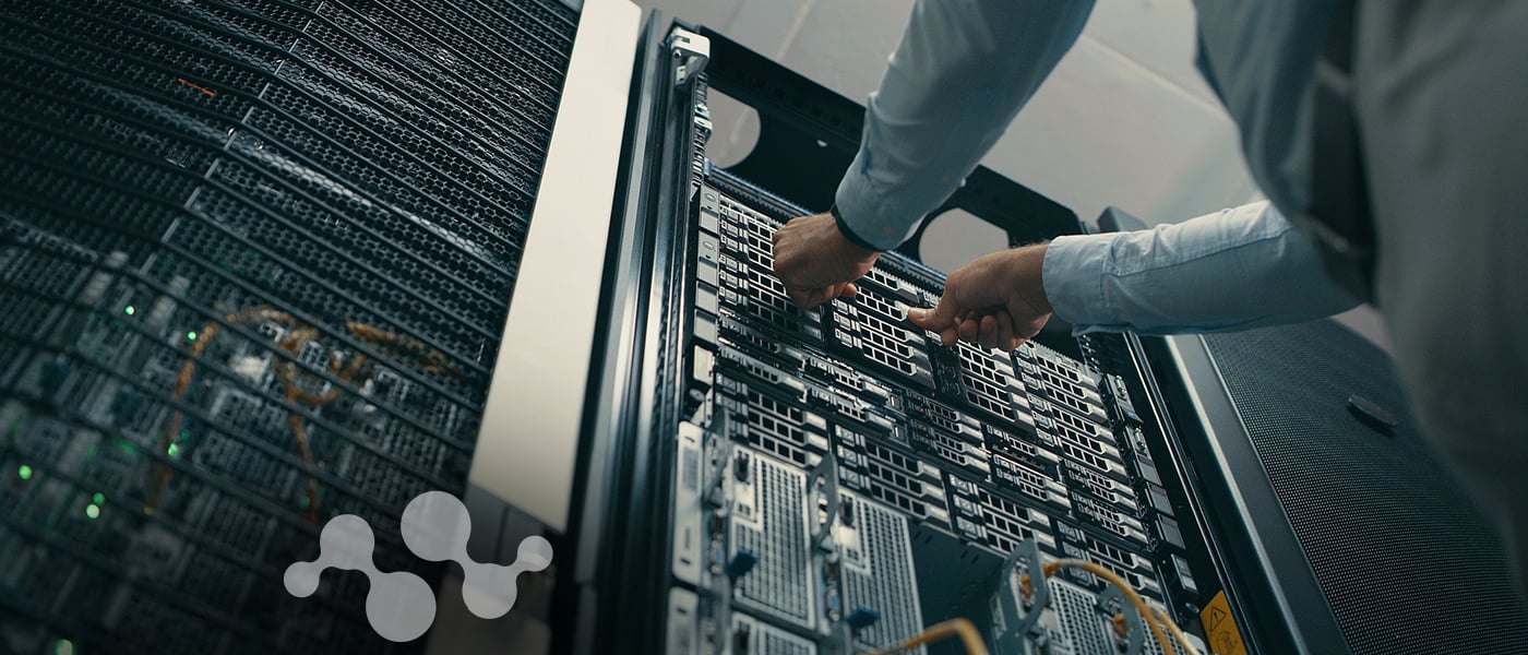 Engineer installing linear pluggable optics module in data center server rack